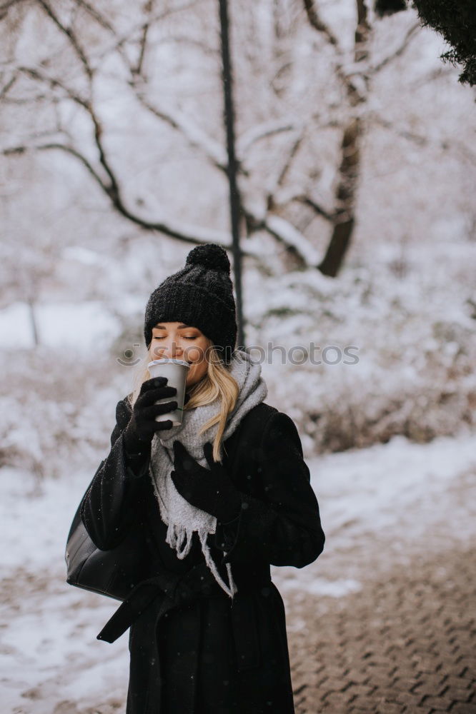 Similar – Young woman wrapped warm against the cold