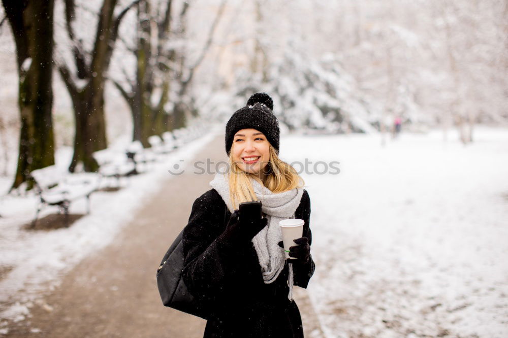 Similar – Young woman sitting on the street