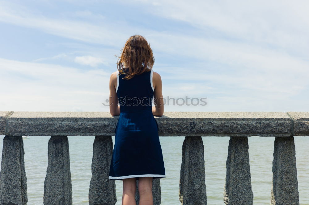 Similar – analogue portrait of a young woman standing barefoot in a glass greenhouse