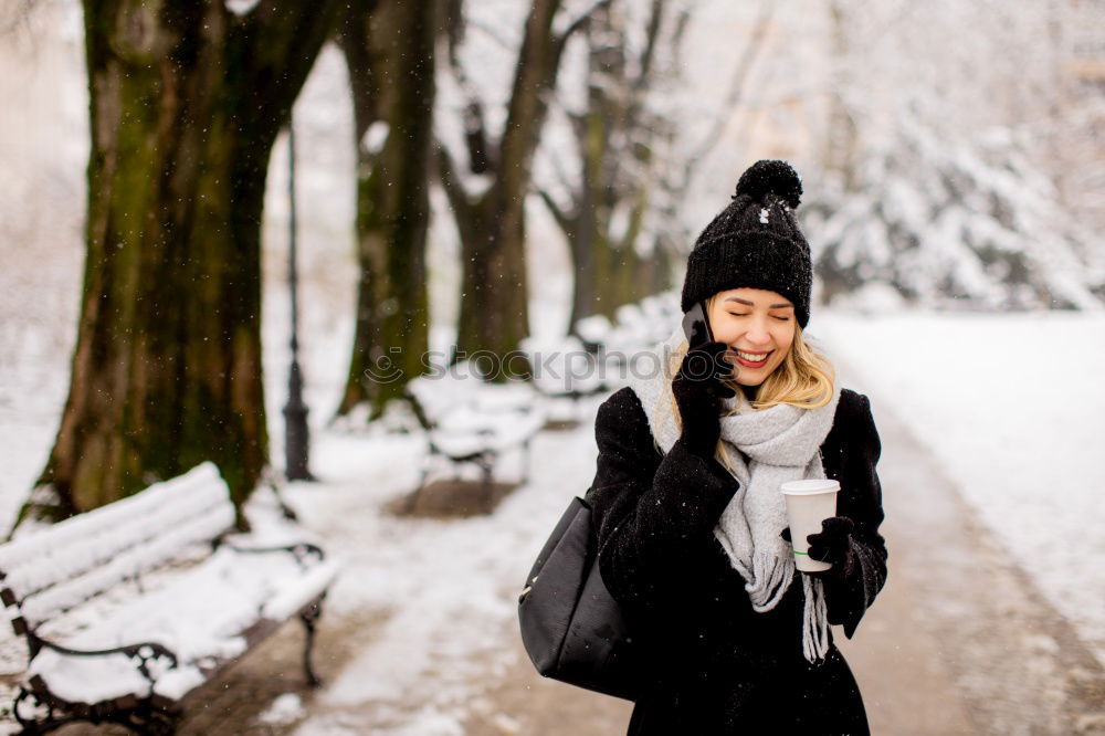 Similar – Young woman wrapped warm against the cold