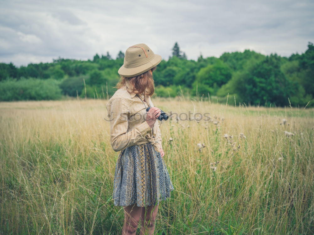 Similar – Image, Stock Photo Woman with short and gray hair in a path