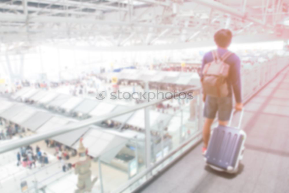 Similar – Image, Stock Photo Back of a young business man standing with the suitcase at the airport waiting for the flight