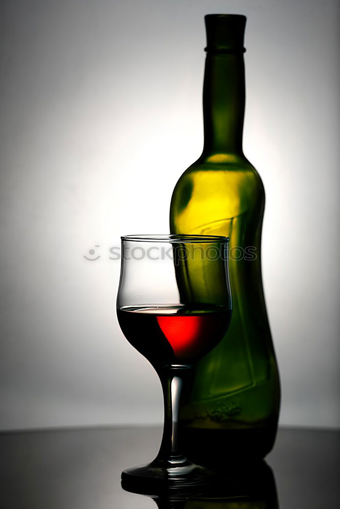 Similar – Red wine bottle and red wine glass with grapes