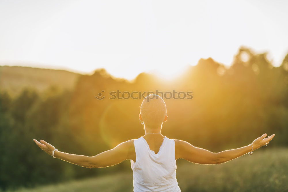 Similar – Cyclist drinking water on the bike at sunset. Sports