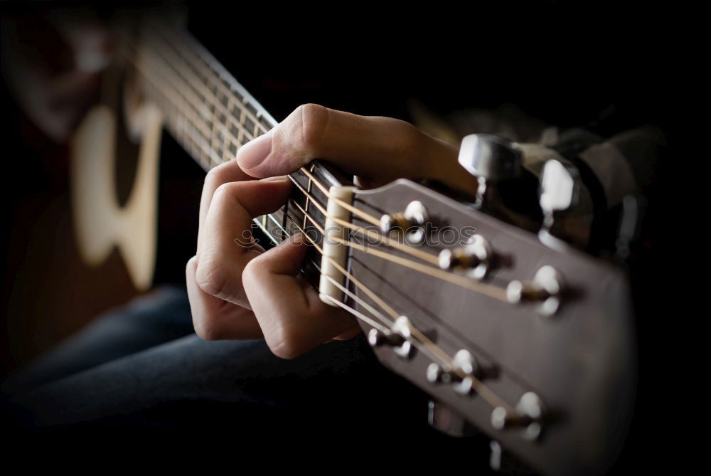 Similar – Young man playing acoustic guitar