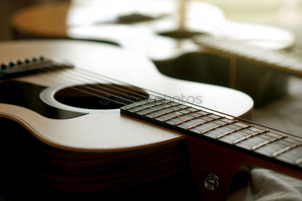 Similar – Young man playing acoustic guitar