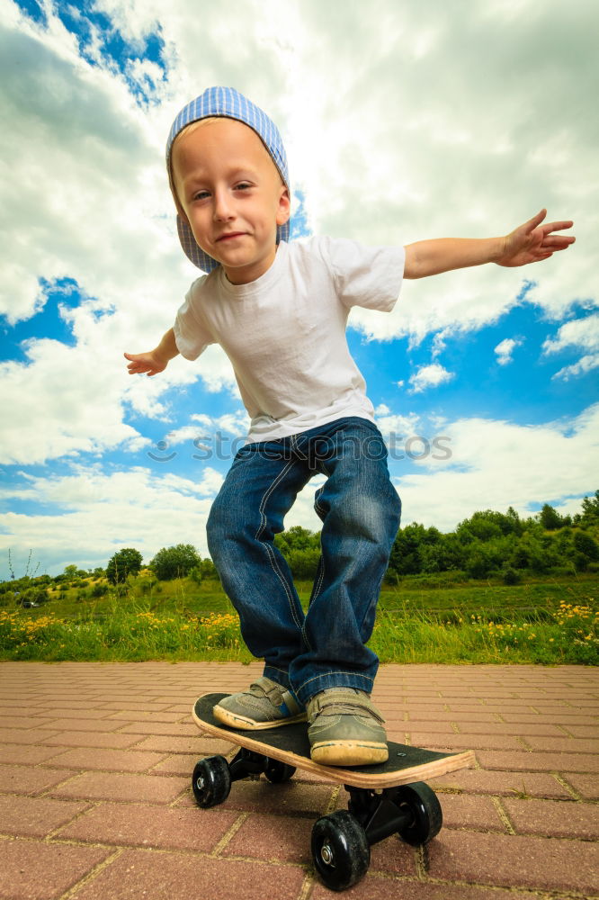 Similar – Boy with skateboard in the park