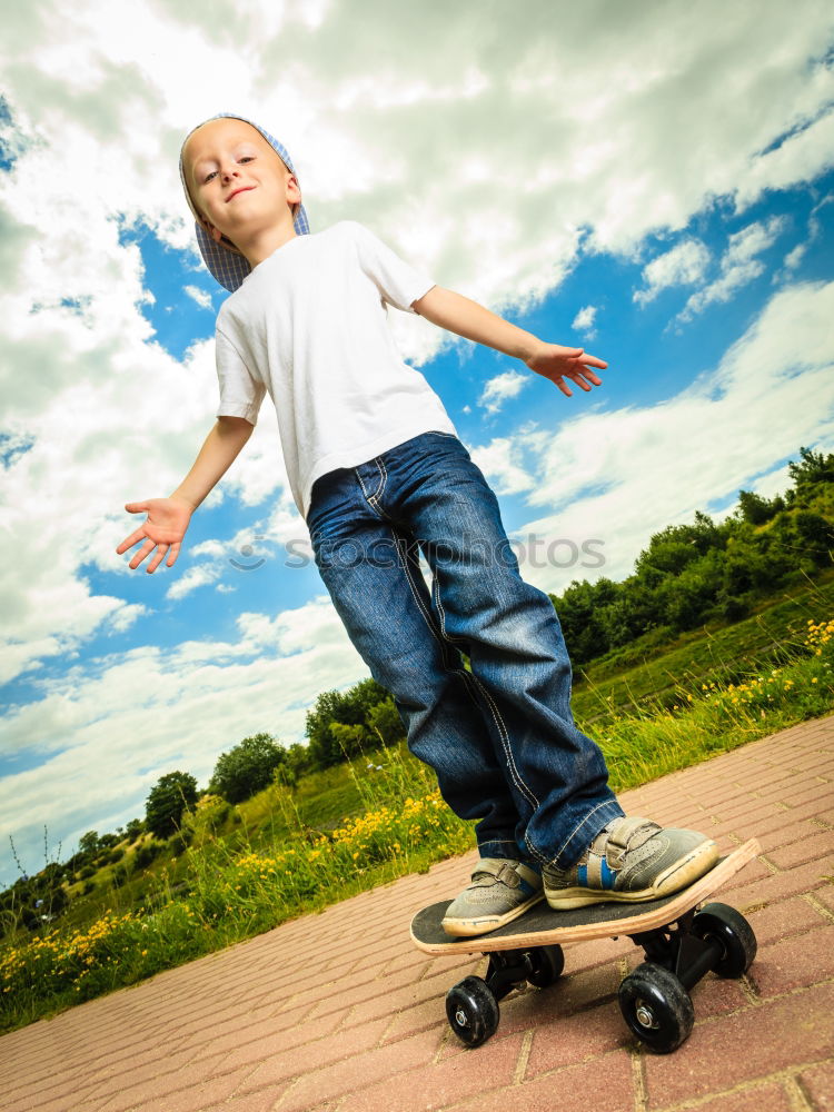 Similar – Boy with skateboard in the park