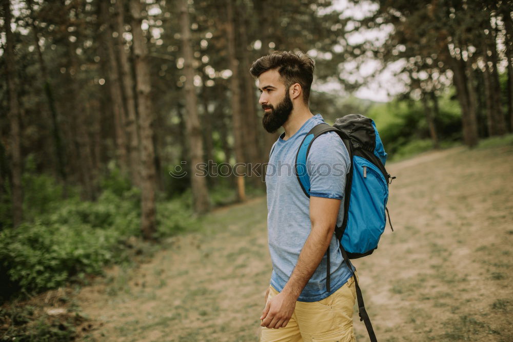 Man navigating on road in woods