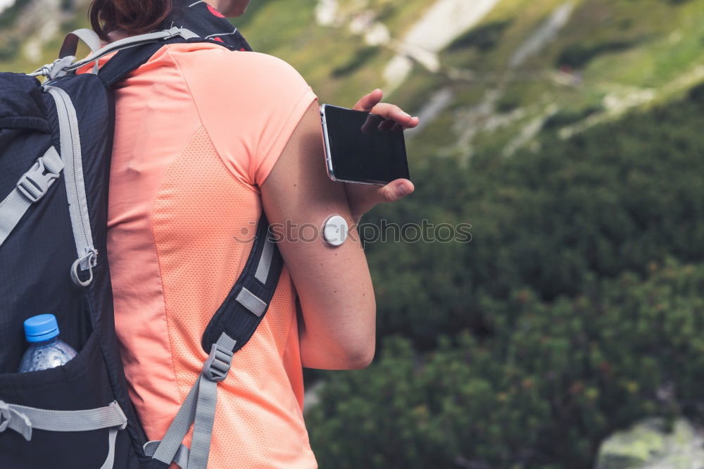 Similar – Hiker closing his partner’s backpack