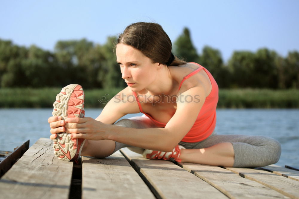 Similar – Image, Stock Photo blonde woman sitting in the grass and stretching in a park