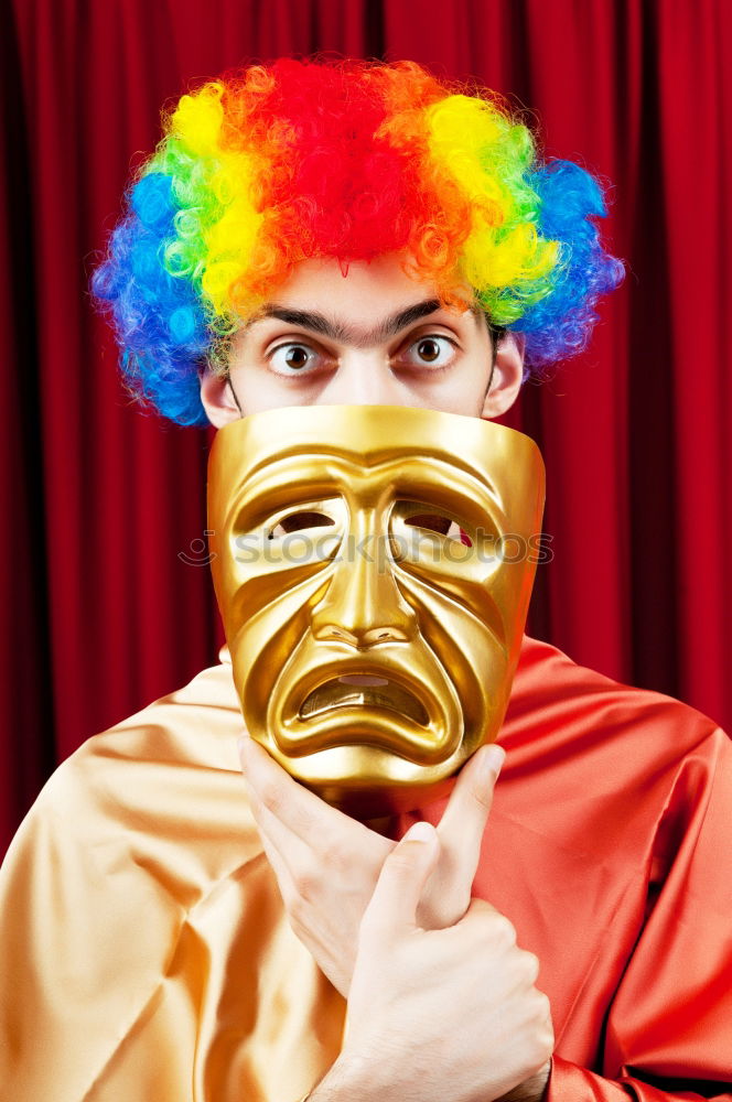 Similar – Woman with monkey mask posing against a yellow background