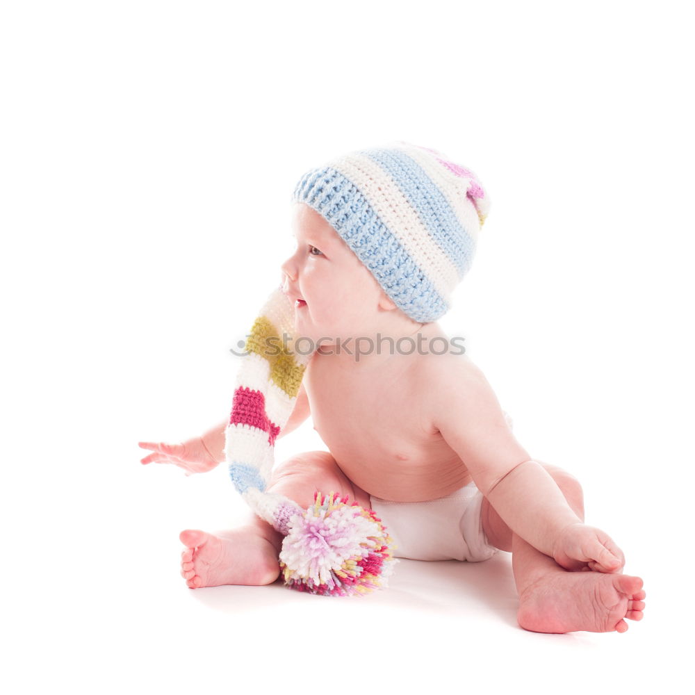 Similar – Baby girl in a bed with toys around.