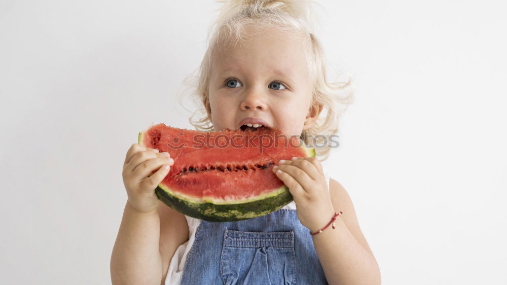 Similar – Image, Stock Photo baby eating an orange on blue background