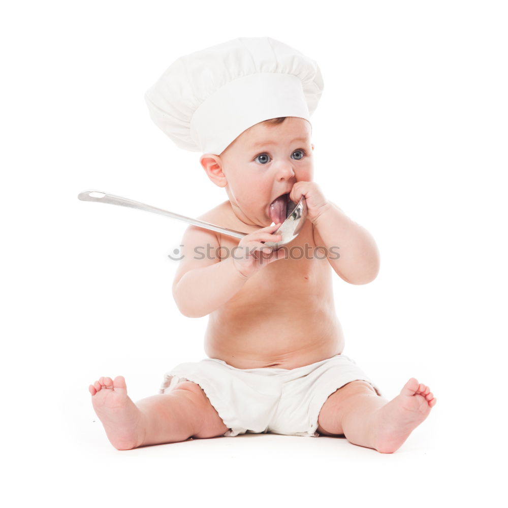 Similar – Image, Stock Photo A cute little girl in chef’s hat sitting on the kitchen floor soiled with flour, playing with food, making a mess and having fun