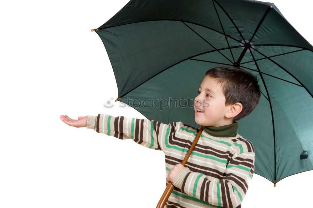 Similar – Little girl standing on rain wearing green raincoat