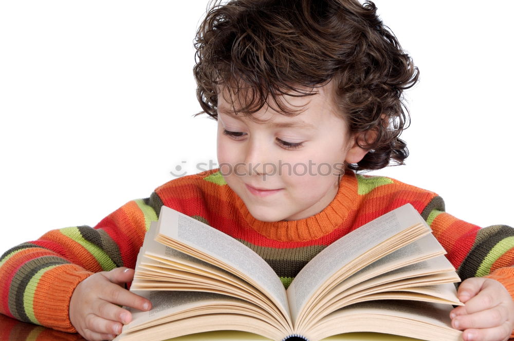 boy reading books on gray background