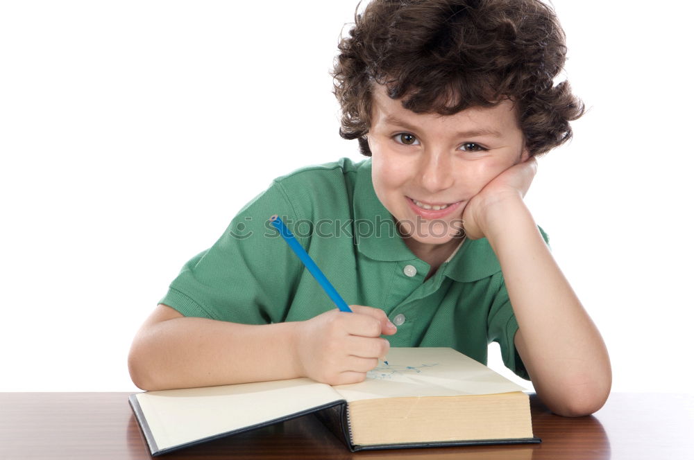 Smiling boy studying