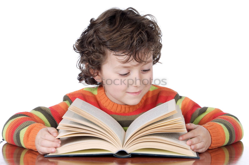 Similar – boy reading books on gray background