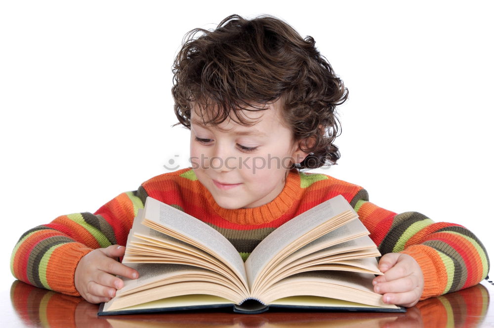 Similar – boy reading books on gray background