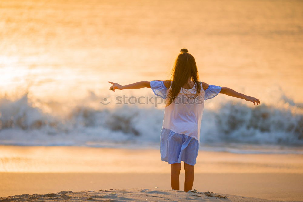 Similar – Image, Stock Photo Father and son playing on the beach at the sunset time. People having fun outdoors. Concept of happy vacation and friendly family.