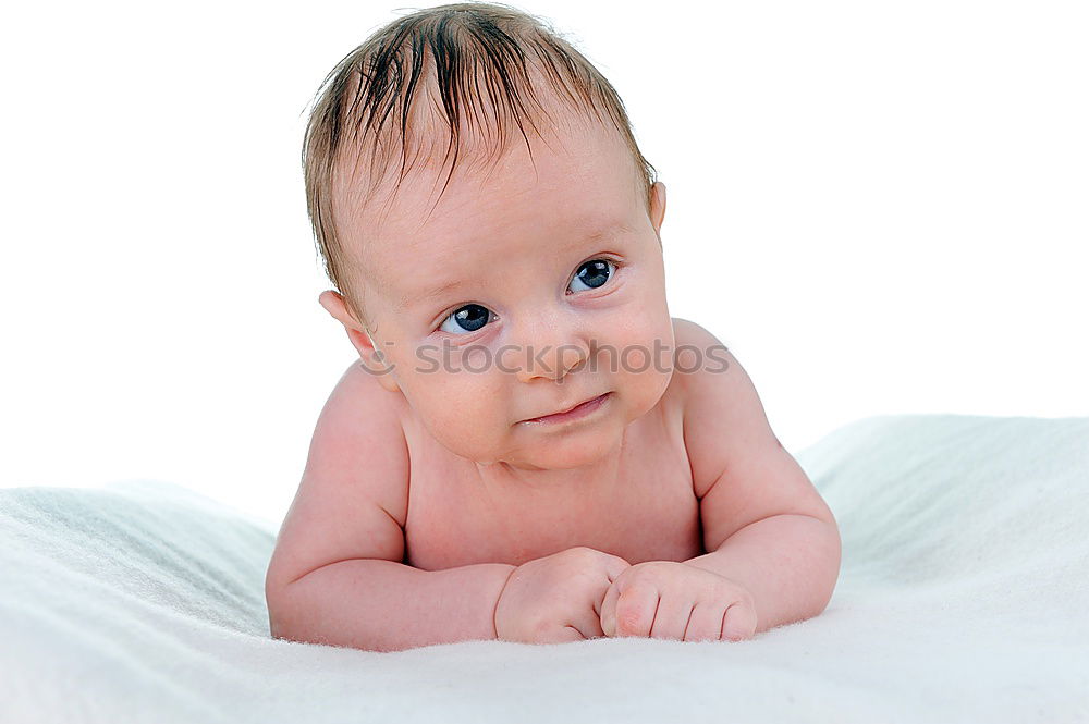 Similar – Baby with a colourful headscarf and blue eyes