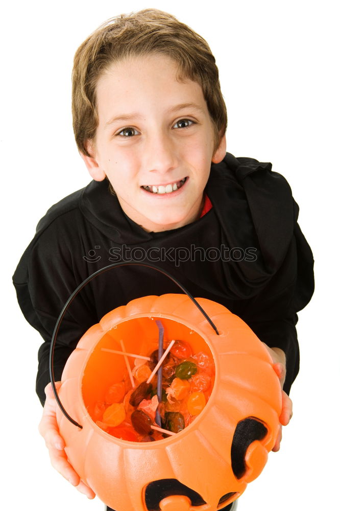 Similar – Image, Stock Photo Beautiful girl disguised of witch decorating a pumpkin at home.