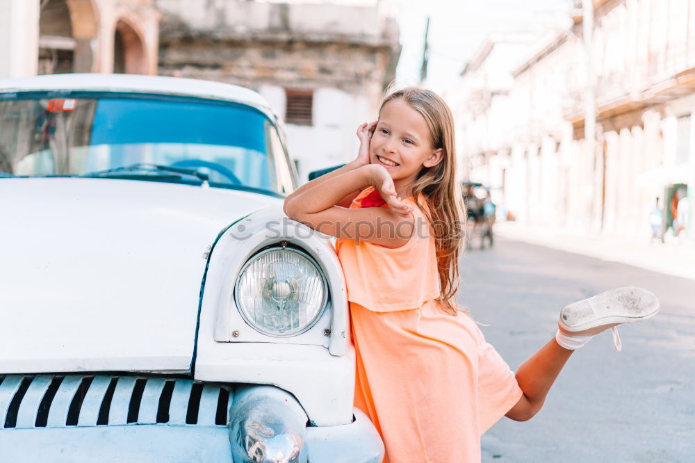 Similar – Young woman in yellow dress walking by the city