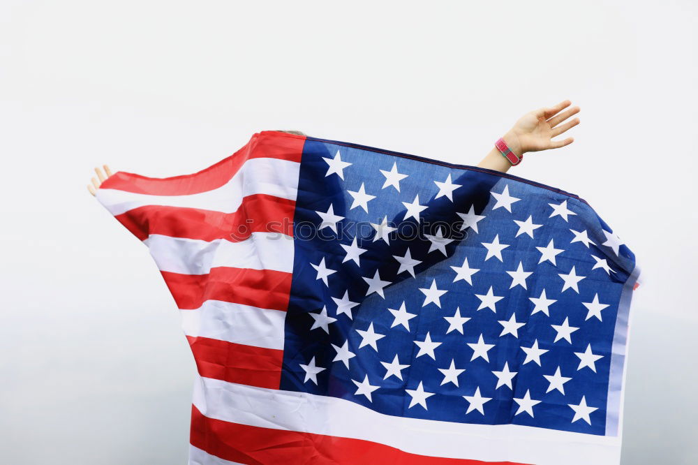 Man holds American flag in hand