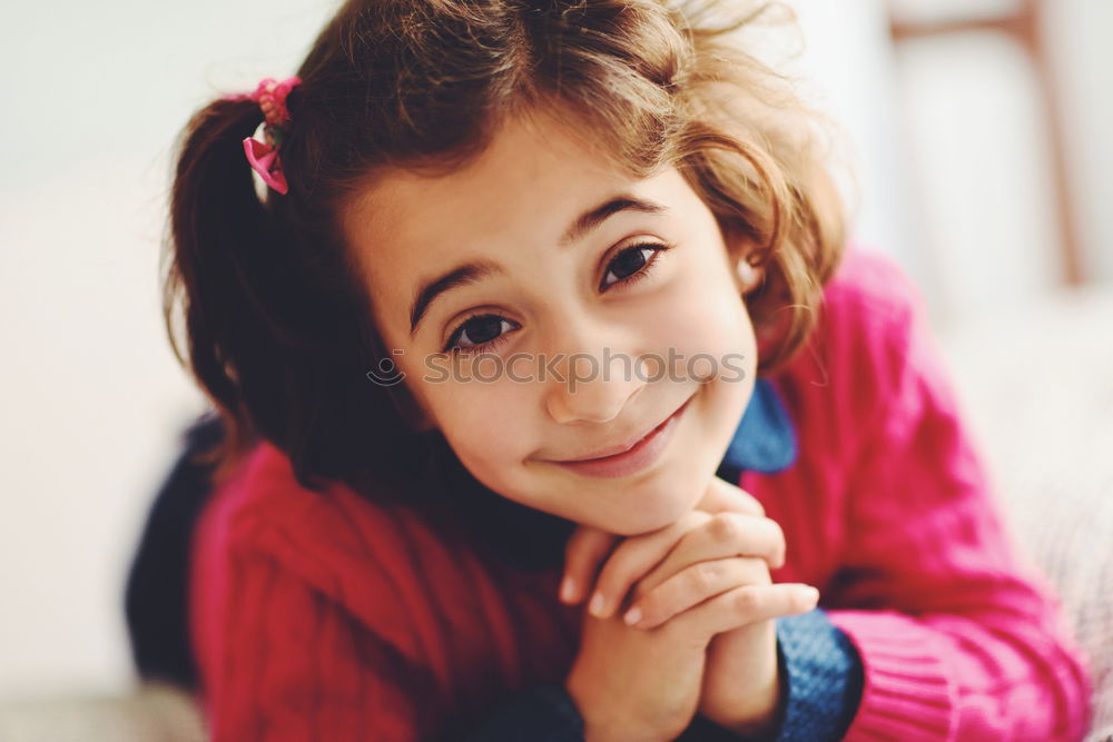 Similar – Adorable little girl with sweet smile lying down on bed.