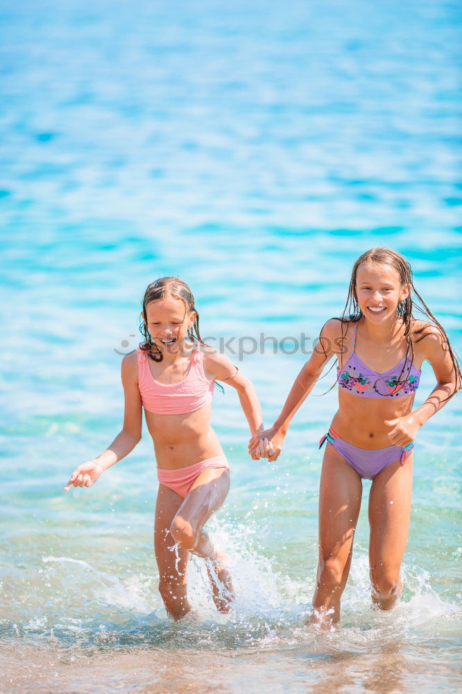 Similar – Two happy children playing on the beach