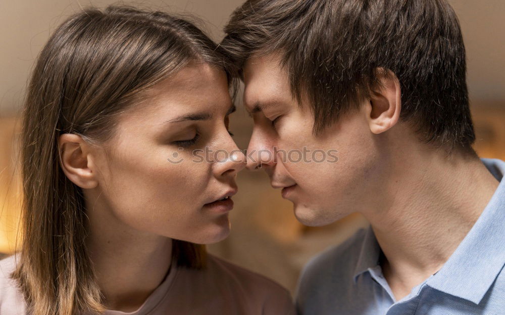 Similar – Couple with fluorescent paint kissing