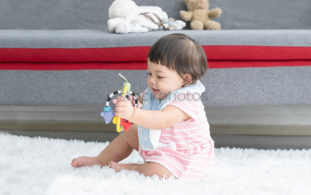 Similar – cute toddler girl put on socks at home