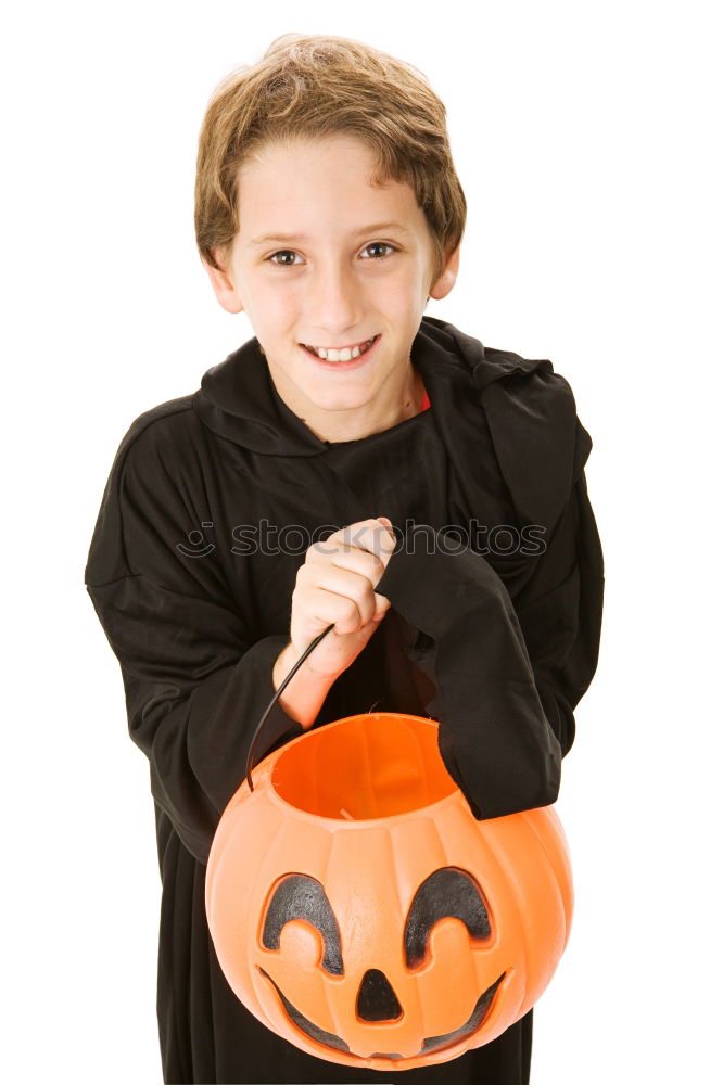 Similar – Image, Stock Photo Young boy in the Skeleton costume holding Halloween pumpkin