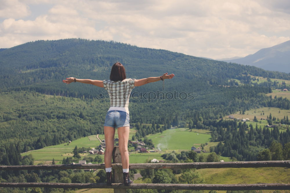 Stylish woman on picturesque landscape