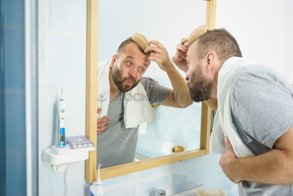 Similar – Image, Stock Photo Man rinsing his toothbrush under running water