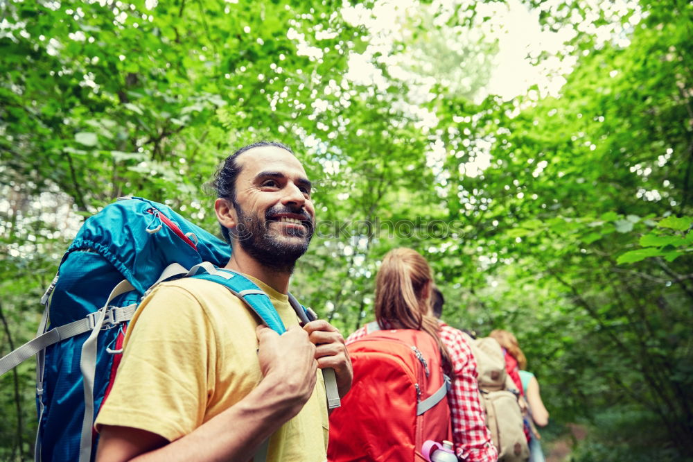 Similar – Woman doing trekking looking at camera