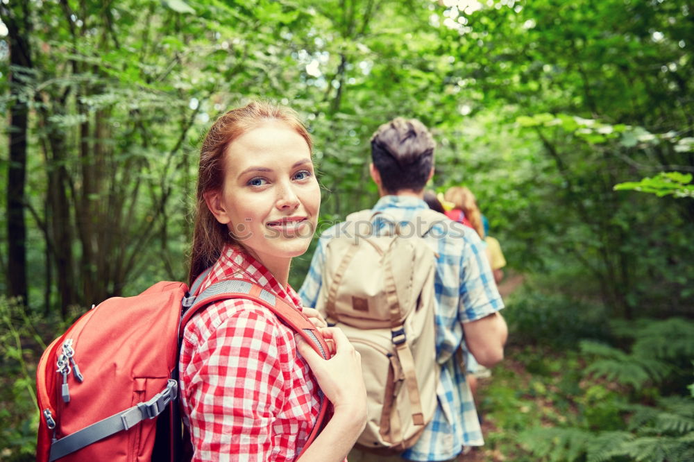 Similar – Woman doing trekking looking at camera