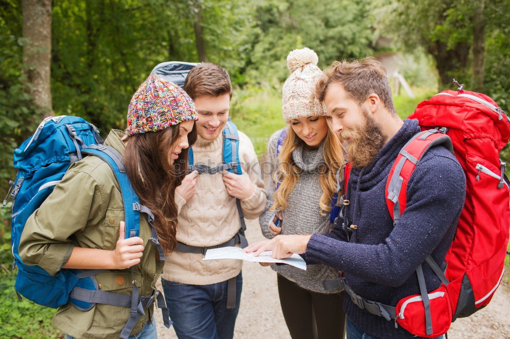 Similar – Image, Stock Photo Couple doing trekking sitting looking mobile and map