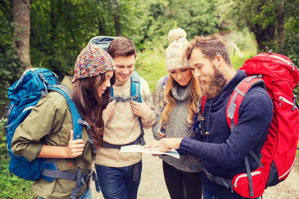 Similar – Image, Stock Photo Couple doing trekking sitting looking mobile and map