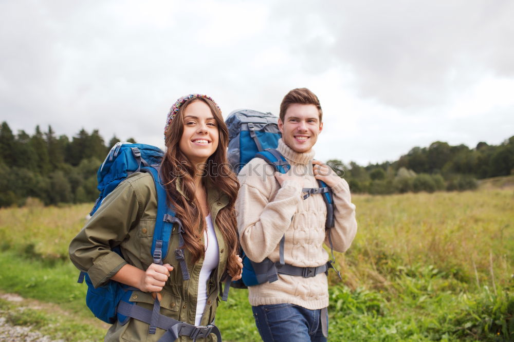 Similar – Woman doing trekking looking at camera