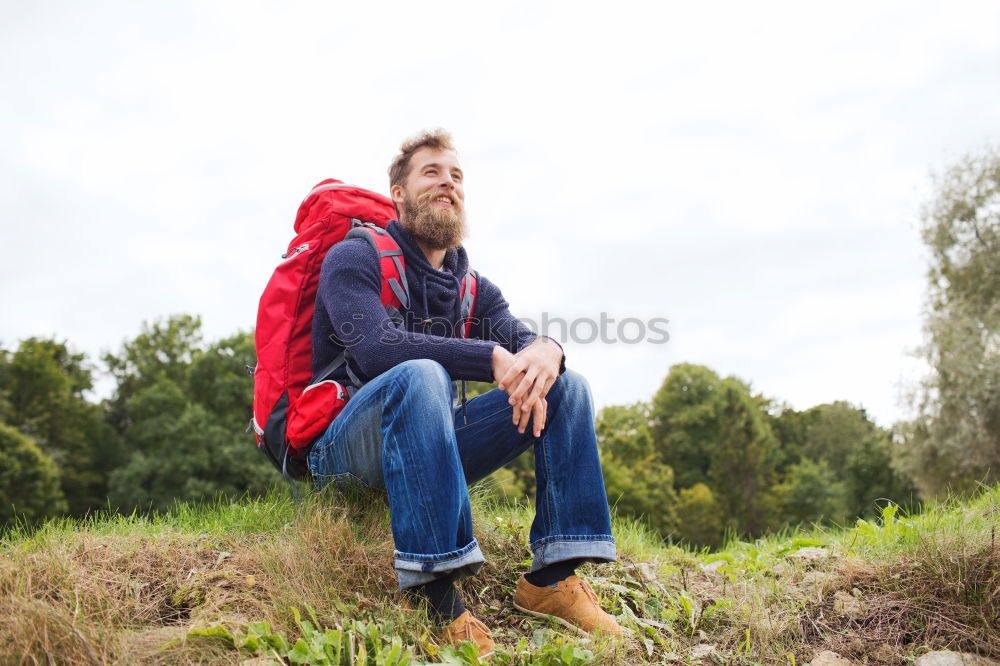 Tourist with camera on field