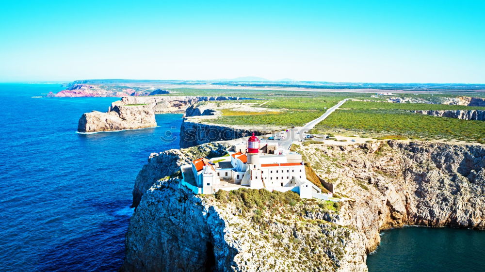 Similar – Wunderschöner Leuchtturm auf den hohen Klippen des Saint Vincent Kaps in der Algarve, Portugal