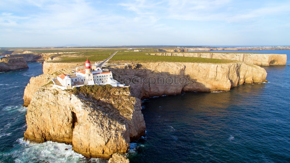 Similar – Wunderschöner Leuchtturm auf den hohen Klippen des Saint Vincent Kaps in der Algarve, Portugal