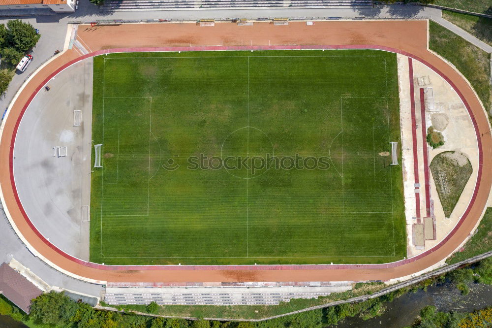 Similar – a green empty soccer field from above