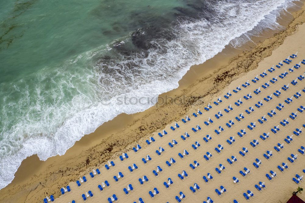 Similar – Drone shot of many people enjoying the beach and the ocean in high season- vacation pattern.