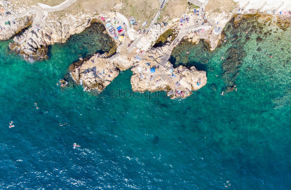 Similar – Rockpool surrounded by the ocean on a sunny day