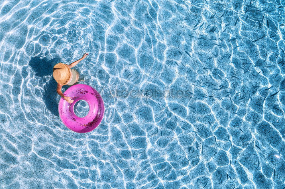 Similar – Image, Stock Photo Woman relaxing on inflatable ring in swimming pool