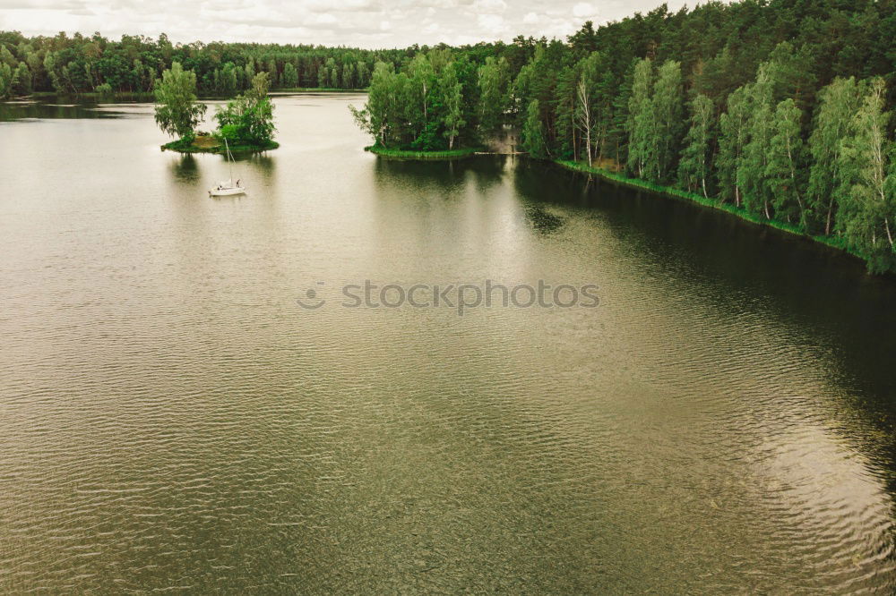 Similar – Image, Stock Photo Romantic lake with island passage and trees.