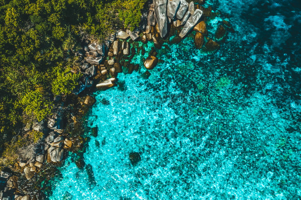 Similar – Boat anchors in rocky bay with turquoise blue sea from above